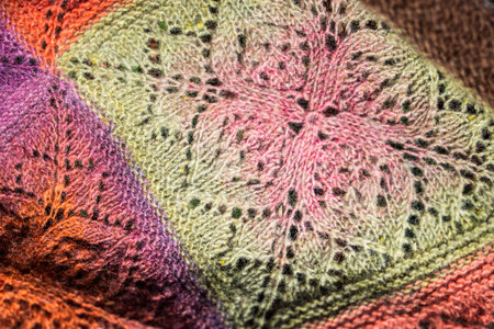 Handmade. Crochet. Woolen thread. Colorful shawl.