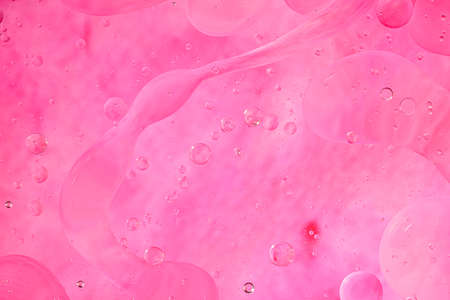 Photo of oil on a water surface with bubbles.soft pink. Abstract colorful background.の写真素材