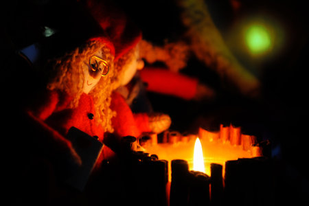Two cute rag dolls sit by the fire at night. Christmas conceptの写真素材
