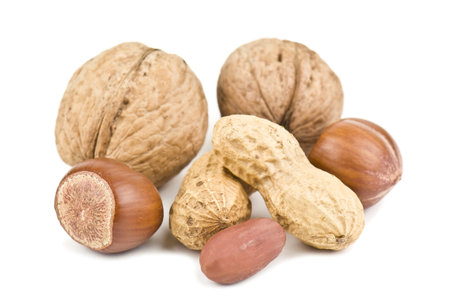 heap of nuts on white