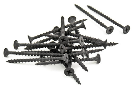 old black screws on whiteの写真素材