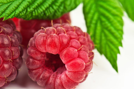 sweet and juicy raspberry on white background