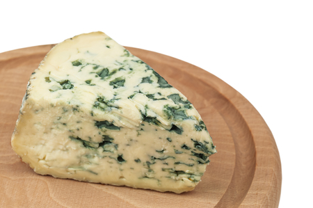 delicious heese whith mold on on wooden plate on white backgroundの写真素材