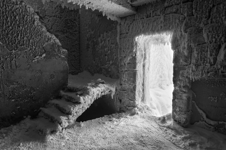 snow-covered abandoned ruins in monochromeの写真素材