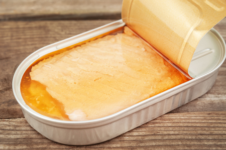 open tin with delicious salmonの写真素材