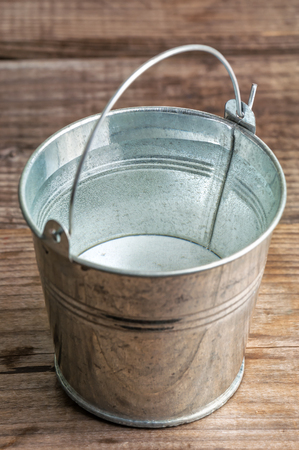 metal bucket with fresh waterの写真素材