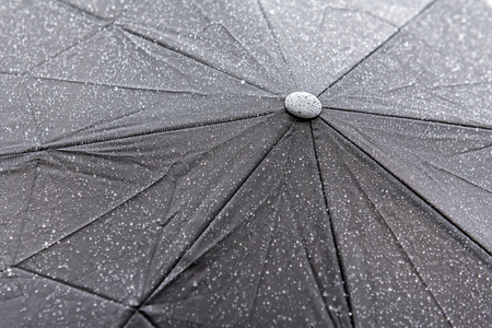 wet black umbrella as a textureの写真素材