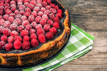 delicious cheesecake with raspberries on green napkinの写真素材
