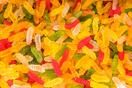 multicolored jelly candies worms as a texture