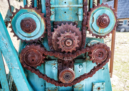 parts of old broken machine under corrosion closeup.Rusty gears and chainsの写真素材