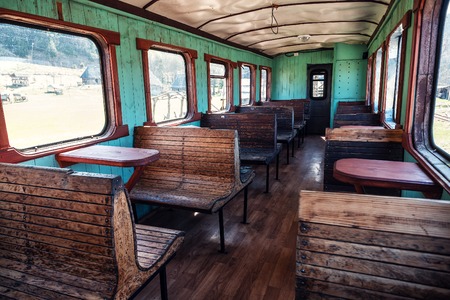 Interior of the abandoned old Soviet-era narrow-gauge railway carの写真素材