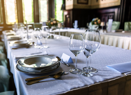 Wedding decor, wine glasses and champagne flutes on table. Selective focusの写真素材