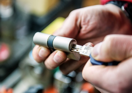 proffesional locksmith master repairs door lock cylinderの写真素材