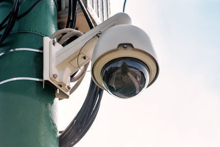 Professional surveillance camera. CCTV mounted on ceiling. LED IR lights around lens. Security...