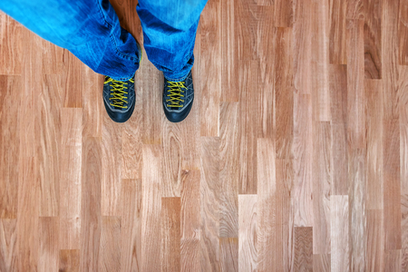 human legs in shoes on the new oak parquetの写真素材