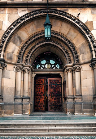 old entrance to the church with portal and wooden doors - Saint Olga and Elizabeth church in Lviv, Ukraineの写真素材