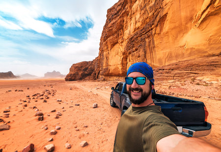 Selfie with tourist and car in Wadi Rum desert. Jordan