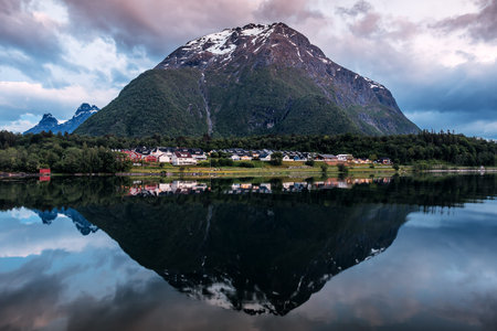 Mountain reflection in water on sunset . Norway. Andalsnesの写真素材