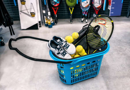 basket with tennis sports goods in the supermarketの写真素材
