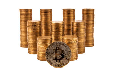Bitcoin and stacks of coins isolated on whiteの写真素材