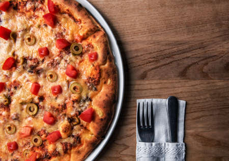 delicious fresh italian pizza on the tableの写真素材