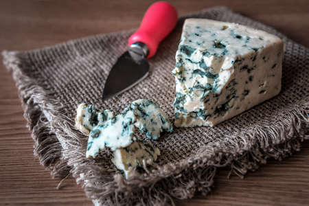 delicious molded cheese on burlap napkin with knifeの写真素材