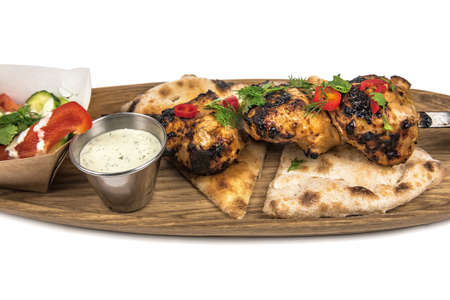 delicious skewers on a skewer isolated on whiteの写真素材