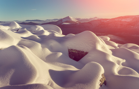Mountain landscape. Winter scene. Fantastic glowing sunlight. Vintage filter.の写真素材