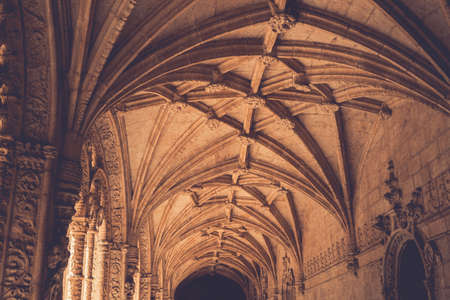 Beautiful reticulated vaulting and columns of Hieronymites Monastery. Manueline architecture style. Famous Lisbon landmark in Belem district and Unesco Heritage. Portugal. Vintage effect.のeditorial素材