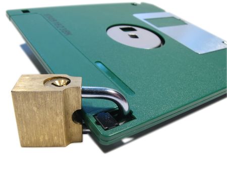 Protection of data. Information safety. A diskette on the lockの写真素材