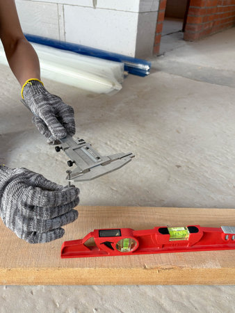 Caliper and level for measuring during construction of a residential building. Measuring tools at...