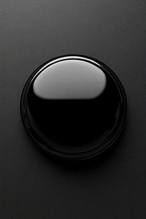 Black button on black background. Mockup for design.の素材