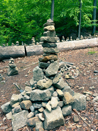 Pyramids are made of small stones in mountainous terrain. Close-up of a stone pyramid standing on a...
