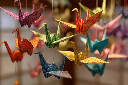 Colorful paper cranes on strings. Origami. Symbol of peace in the world.の素材