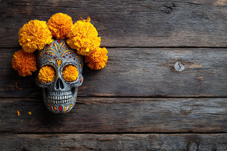 Banner with skull and wreath of marigold flowers on wooden horizontal background. Symbol of Mexican Day of the Dead.の素材