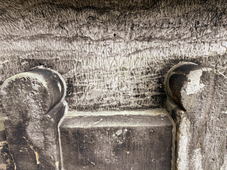 Ancient rocks. The throne is carved into the rocks. The texture of the stone wall. Traces of ancient civilizations.の写真素材