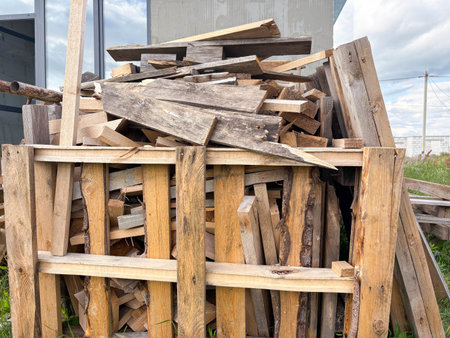 a large pile of wooden construction waste at a construction site. Collection of construction waste.の写真素材