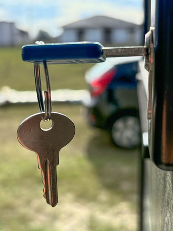 The key to a new building in the private sector is inserted into the door. Houses with land are available for rent and sale. Mortgages for new homes, purchases, sales, and property renovations.の写真素材