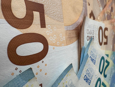Euro banknotes laid out on a table. Close up of banknotes equivalent to 50 and 20 euros