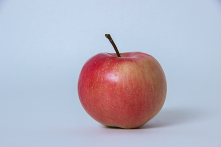 Fresh red apple on a gray backgroundの写真素材