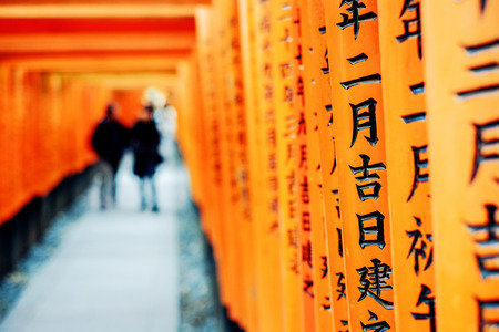 The world cultural heritage, red gate way, torii corridor in Fushimi Inari Taisha, traditional temple in Kyoto, Japanのeditorial素材