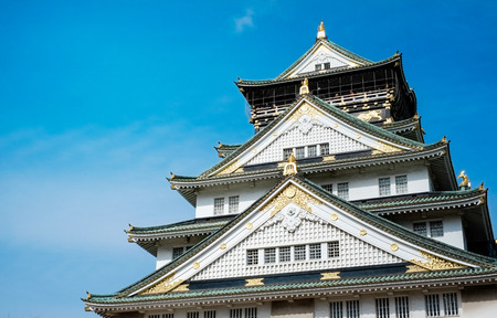 The famous heritage, Osaka castle under bright blue dramatic cloudy sky and sunshine in Japanのeditorial素材