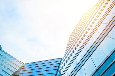 Business concept for real estate and corporate construction - looking up view in financial district,...
