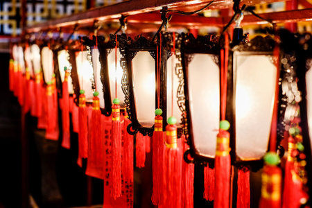 Red lantern, people pray to god for blessing in traditional old oriental chinese temple in Hong...