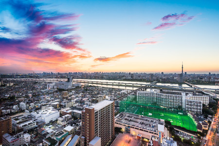 Business and culture concept - panoramic modern city skyline bird eye aerial view with Mountain Fuji and tokyo skytree under dramatic sunset glow and beautiful cloudy sky in Tokyo, Japanのeditorial素材