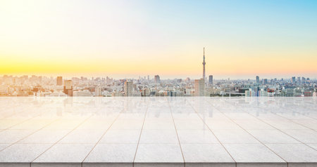 Business concept - Empty marble floor top with panoramic modern cityscape building bird eye aerial view under sunrise and morning blue bright sky of Tokyo skytree, Japan for display or montage productのeditorial素材