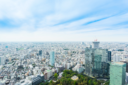 Business and culture concept - panoramic modern city skyline bird eye aerial view under dramatic sun and morning blue cloudy sky in Tokyo, Japanのeditorial素材