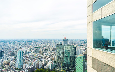 Business and culture concept - panoramic modern city skyline bird eye aerial view with tourist under dramatic sun and morning blue cloudy sky in Tokyo, Japanのeditorial素材