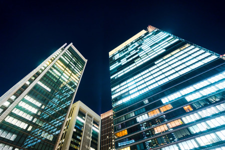 Business concept for real estate and corporate construction - panoramic modern city skyline bird eye aerial night view under dramatic glow and beautiful dark blue sky in Tokyo,Japanのeditorial素材