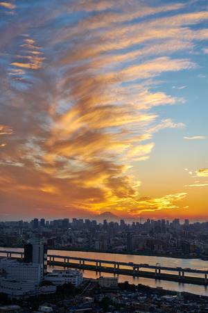 Asia Business concept for real estate and corporate construction - vertical modern cityscape building bird eye aerial view with Mount Fuji under sunrise and morning blue bright sky in Tokyo,Japanのeditorial素材